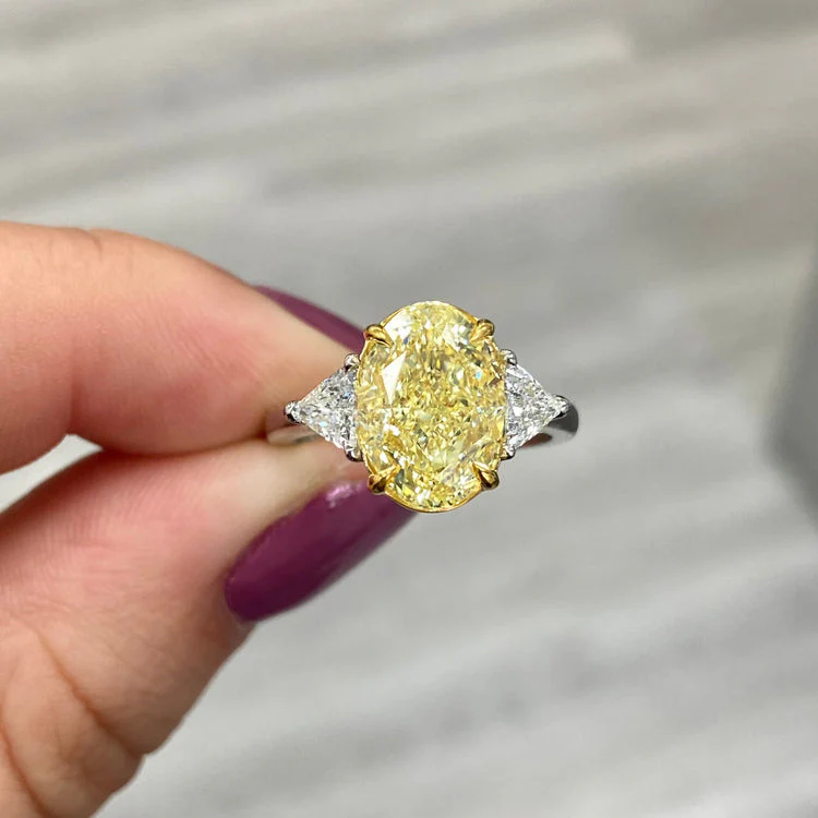 4Carat Fancy Yellow Oval Three Stone DIamond Ring